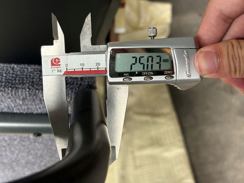 measuring the tube during hotel furniture inspection and quality control