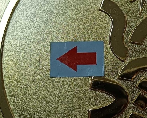 scratch-marks-found-during-metal-badge-quality-control