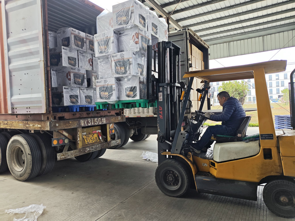 The forklift operator is performing container loading
